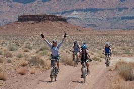 Desert scene with bicyclists training